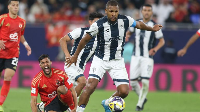 Yahya Attiat-Allah of Al Ahly, bottom, reacts after competing for the ball against Salomon Rondon of CF Pachuca during the Intercontinental Cup football match between CF Pachuca and Al Ahly FC at Stadium 974 in Doha, Qatar, on Saturday, December 14, 2024. (AP Photo/Hussein Sayed)