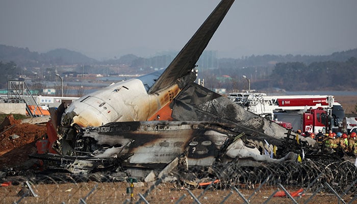 Rescue workers take part in a rescue operation at the site where a plane crashed after skidding off the runway at Muan International Airport in Muan, South Korea, December 29, 2024. – Reuters