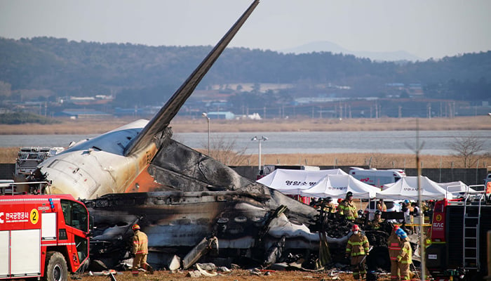 Firefighters carry out rescue operations on a plane that skidded off the runway at Muan International Airport in Muan, South Jeolla province, South Korea, December 29, 2024. – Reuters