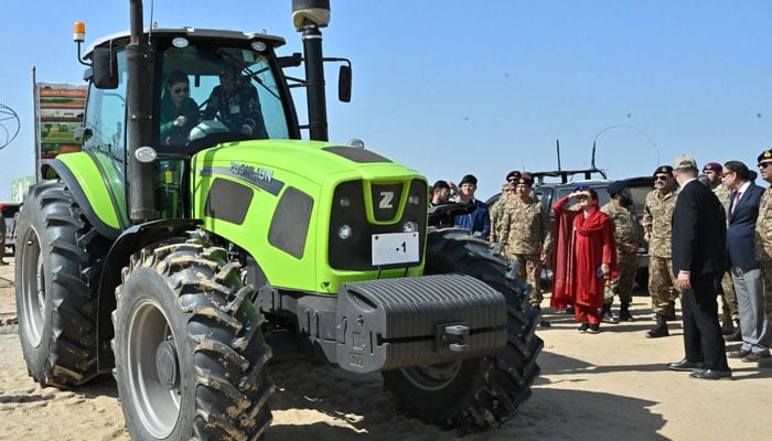 The COAS general also inspects a tractor that is exhibited at the launch ceremony of the Pakistan Green Initiative in Cholistan on February 15, 2025. - PakGazette News