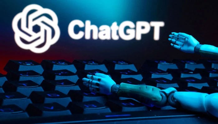 The chatgpt logo, a keyboard and the robot hands are seen in this illustration taken on January 27, 2025. - Reuters