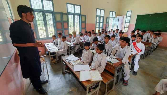 A school teacher who teaches young children in a Pakistani school. - Reuters/file