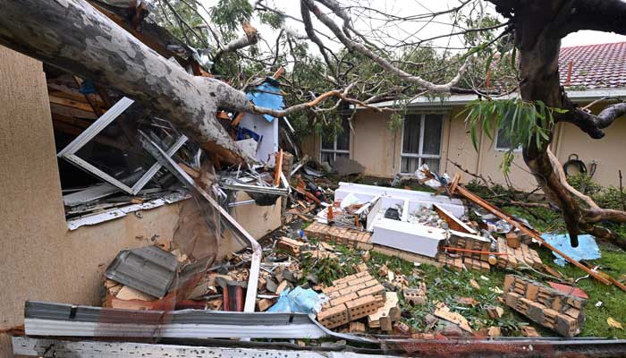 The rubble are in a house damaged by a fallen rubber tree ahead of the Tropical Cyclone Alfreds Landfall, in Mudgea in Gold Coast, Australia, on March 7, 2025. - Reuters