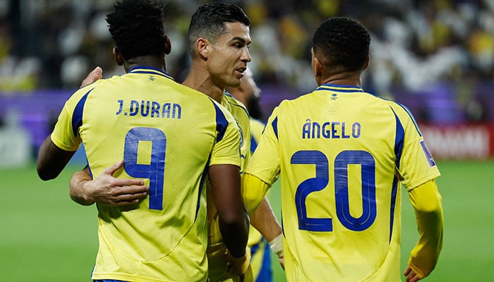 Al Nassrs Jhon Duran celebrates scoring his third goal with Cristiano Ronaldo and Angelo Gabriel in a match against Esteghlal on March 10, 2025. - Reuters