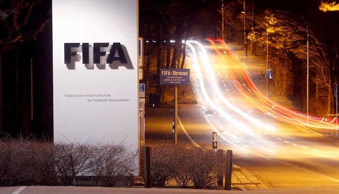 A long exposure shows the Fifas logo near its headquarters in Zurich, Switzerland, on February 27, 2022. - Reuters