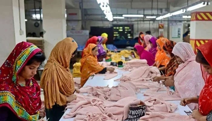 This representation image shows women who work in a clothing factory. - AFP/file