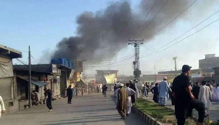 This representation image shows the residents gathered along a road in a market in Parachinar, the capital of the Kurram district. - AFP/file