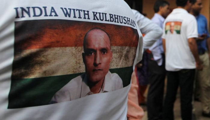 People wait before issuing a verdict in the case of the International Court of Justice of the Kulbhushan Indian by the International Court of Justice, in Mumbai, July 17, 2019. - Reuters