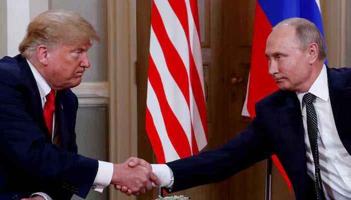 The president of the United States, Donald Trump, and Russian President Vladimir Putin Shake Hands while they are in Helsinki, Finland, July 16, 2018. - Reuters