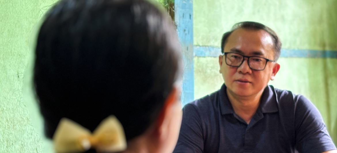 Thein Zaw Win, Communications and Advocacy Analy at the Yangon office of the UNFPA, speaks with a woman affected by the recent earthquake in Mandalay, Myanmar. Thein Zaw Win, Communications and Advocacy Analy at the Yangon office of the UNFPA, speaks with a woman affected by the recent earthquake in Mandalay, Myanmar.