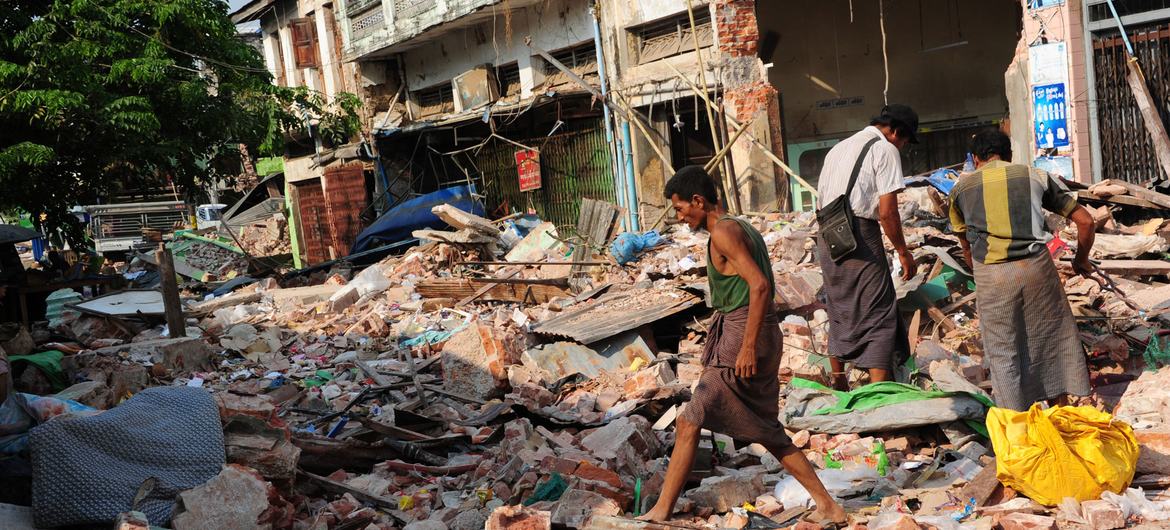 The survivors of the earthquake survey the ruins of their homes in Pyinmana, Myanmar, after the earthquake there. The survivors of the earthquake survey the ruins of their homes in Pyinmana, Myanmar, after the earthquake there.