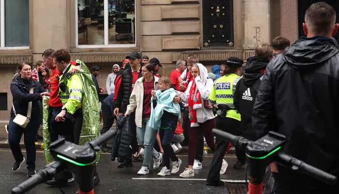 Soccer Soccer - Premier League - Parade of the Victory of Liverpool - Liverpool, Great Britain - May 26, 2025 Liverpool fans look after several people were run over by a car during the victory parade. - Reuters