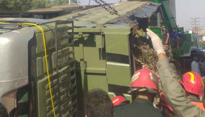 Rescue officials can be seen at the Dumper Truck accident site in Lahore.