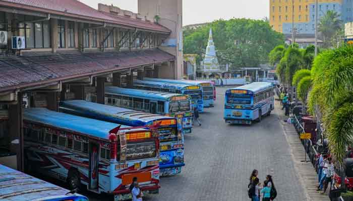 The image shows buses parked in a bus station in Sri Lanka. - AFP/file