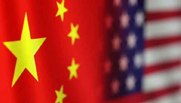 The image shows the flags of China and the United States. - Reuters/file