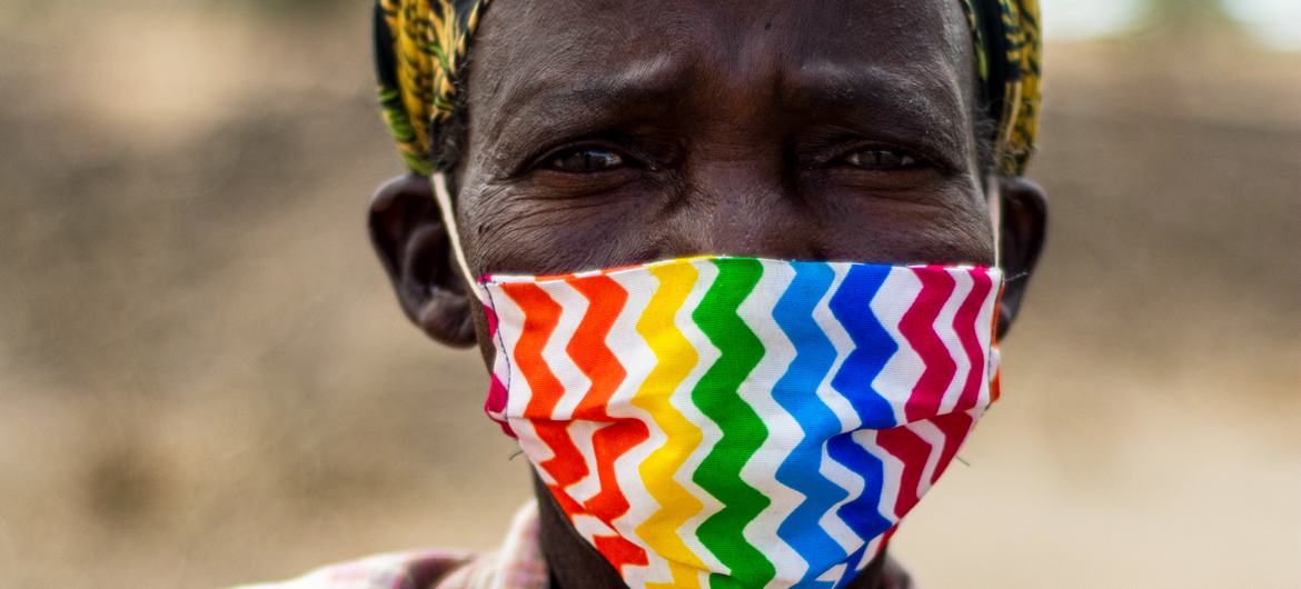 A woman with a mask, Malawi. A woman with a mask, Malawi.