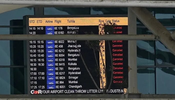 A screen that shows canceled flights is shown at the Indira Gandhi International Airport after a part of the terminal roof collapsed after heavy rains in New Delhi on June 28, 2024. AFP