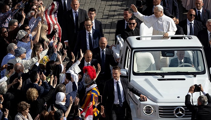 Pope Leo XIV arrives at Popemobile for his inaugural mass in the Vatican, May 18, 2025. - Reuters