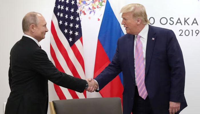 The president of Russias, Vladimir Putin, shakes hand to the president of the United States, Donald Trump, during a meeting outside the G20 summit in Osaka, Japan, on June 28, 2019. - Reuters