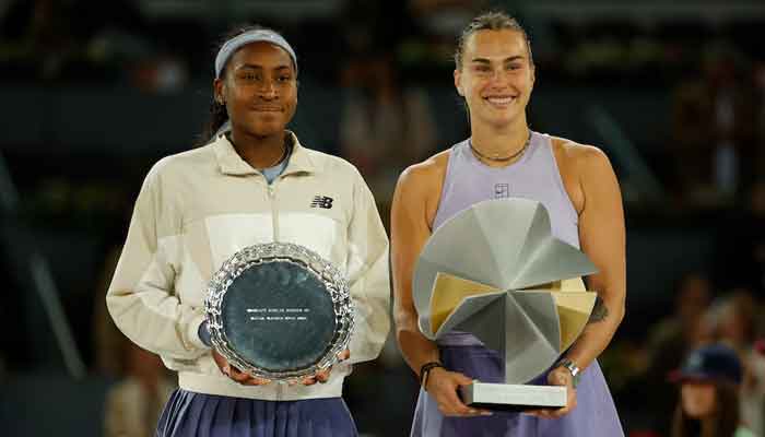 Aryna Sabalenka and Coco Goteff of the United States pose with the winners and trophies finalists after the final of the singles for women. - Reuters