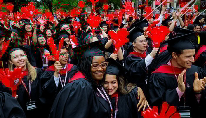 Graduated students react during the 374th graduation exercises at Harvard University in Cambridge, Massachusetts, USA, May 29, 2025. - Reuters