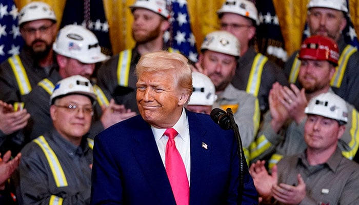 The president of the United States, Donald Trump, reacts along with the workers of the coal industry, the day he signs executive orders related to energy in the White House in Washington, DC, USA UU., April 8, 2025.-Reuters