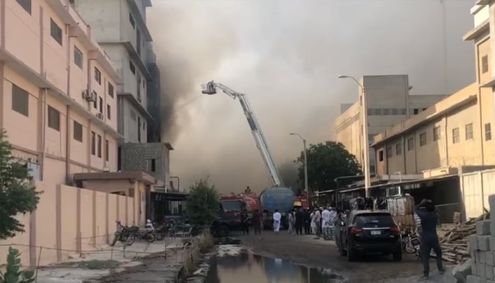 Firefighters who use a snorkeling at the Factory Fire site in Landhi Export Processing Zone, Karachi, on June 8, 2025. - Screengrab through PakGazette News