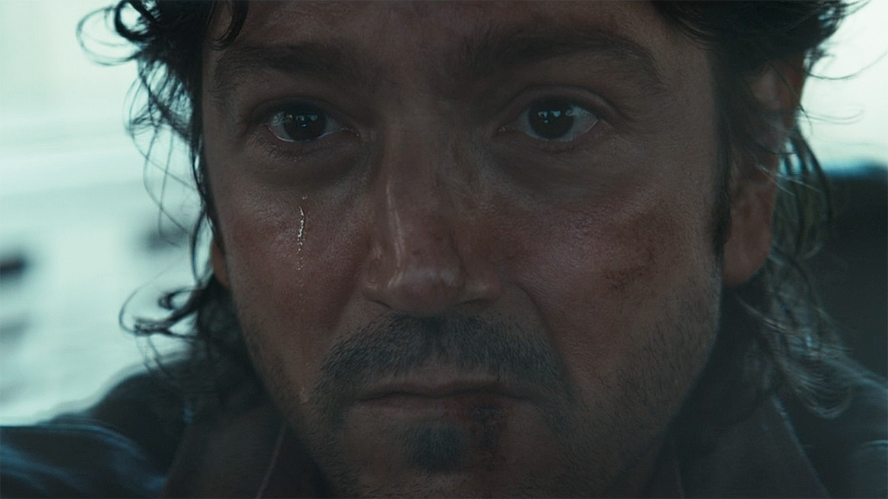 A foreground of Cassian Andor crying in Andor season 2 episode 8