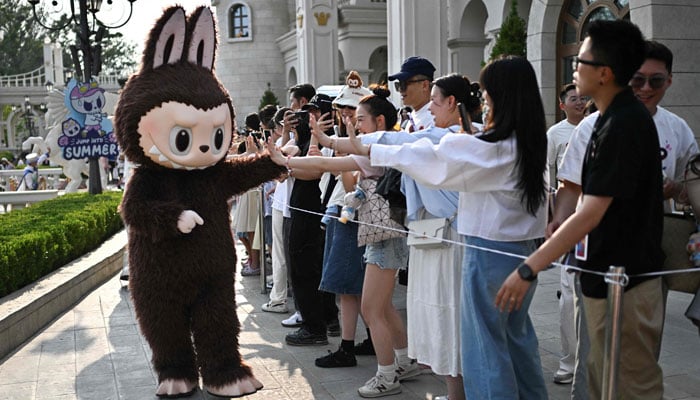 The Labubu character participates in a Pop presentation Mart Park Land in Beijing, China, on June 18, 2025. - AFP