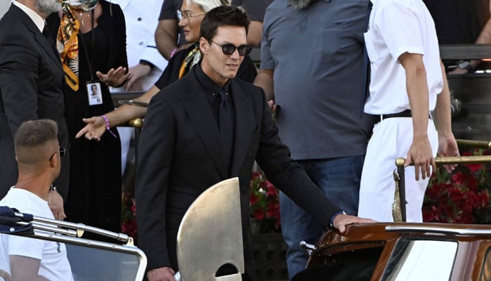 American football player Tom Brady leaves the Gritti Palace hotel on the wedding day of the founder of Amazon Jeff Bezos with Lauren Sánchez, in Venice on June 27, 2025. - AFP