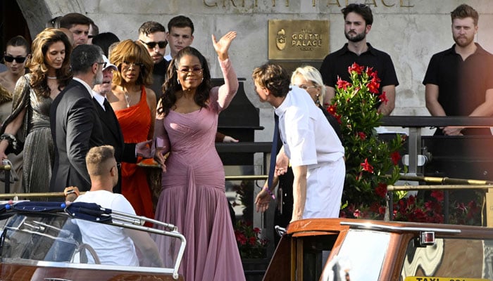 The American journalist Gayle King (left), the American television presenter Oprah Winfrey, leaves the Hotel Gritti Palace on the wedding day of Amazon's founder Jeff Bezos with Lauren Sánchez, in Venice on June 27, 2025. - AFP