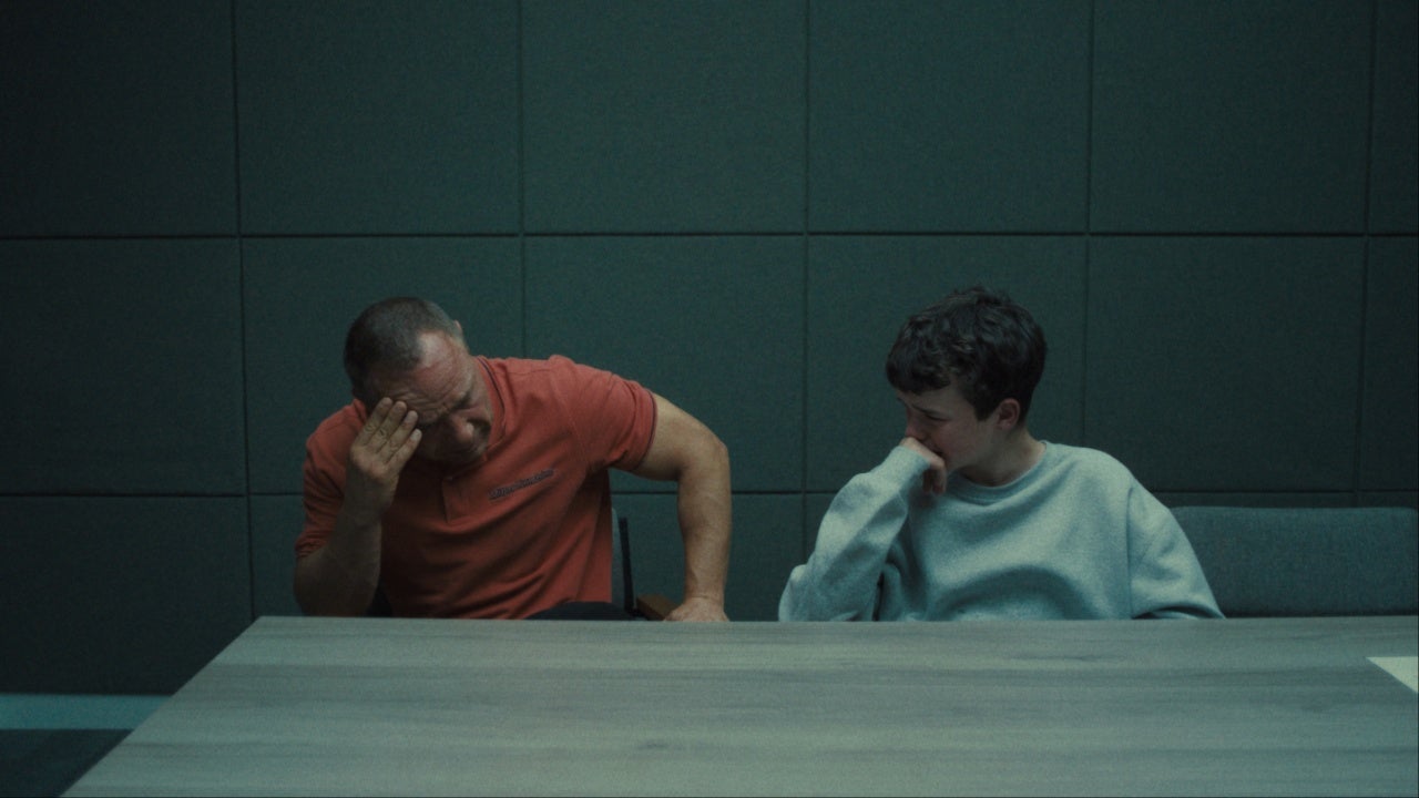 Eddie and Jamie cry in a police interview room in the Netflix adolescence television series
