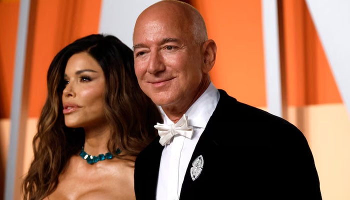Lauren Sánchez and Jeff Bezos arrive at the Vanity Fair Oscar Party after the 97th Academy Awards, in Beverly Hills, California, USA, March 2, 2025. - Reuters
