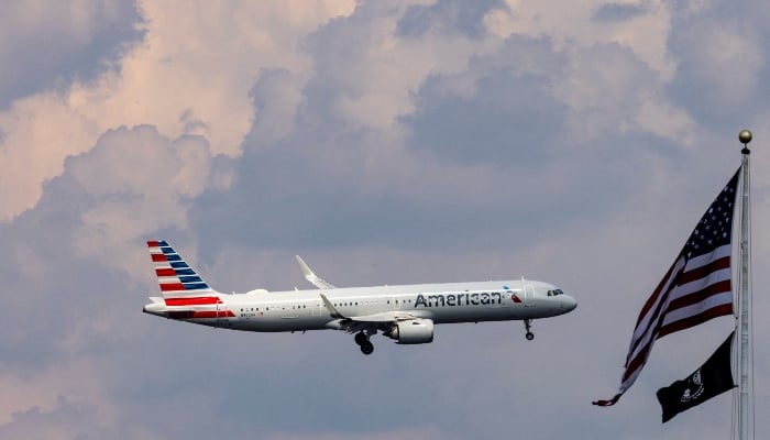 An American Airlines commercial plane flies on Washington as it approaches to land at the Dulles International Airport, as seen in Washington, USA., August 5, 2024. - Reuters