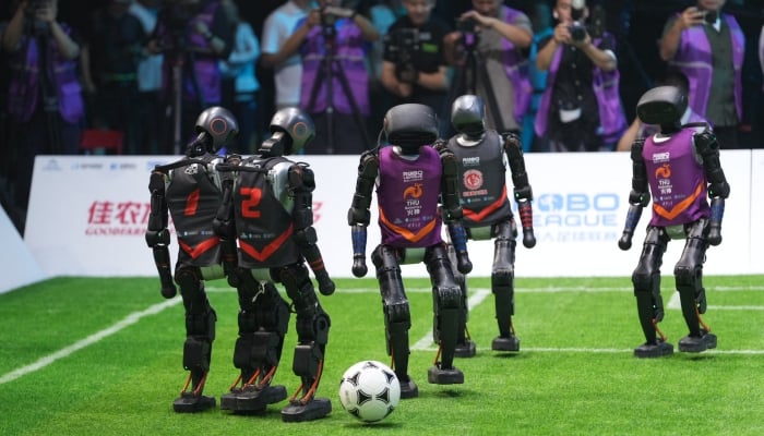 Humanoid robots can be seen playing football in Beijing, China. –X/@Dailybeijing