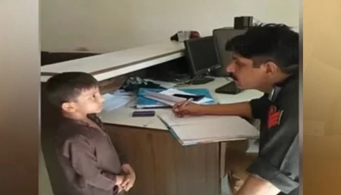 A police officer files a complaint filed by a child at the police station. - Screengrab/YouTube/PakGazette News