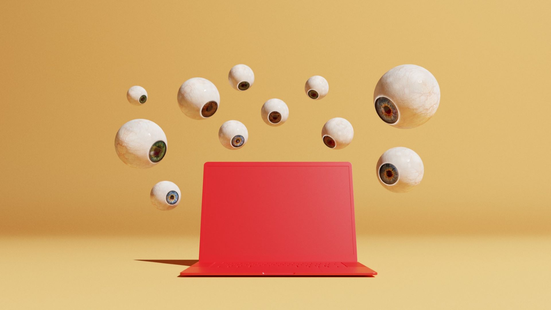 The conceptual image with a lot of floating ocular balloons in different sizes with a view to a red computer could symbolize ideas around malware and computer viruses.