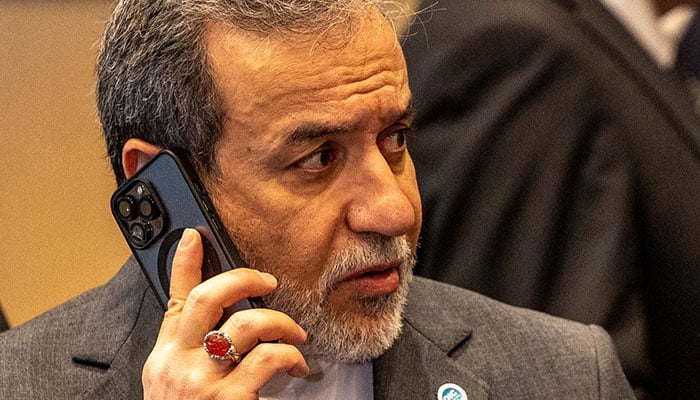 Iranian Foreign Minister Abbas Araghchi makes a telephone call during the 51st Session of the Council of Foreign Ministers of the Islamic Cooperation Organization (OIC) in Istanbul, Turkey, June 21, 2025. - Reuters