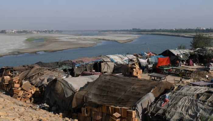 A view of the campaign stores, belonging to the illegal occupants, in the dry bed of the Indo River in Hyderabad, on April 25, 2025. - Reuters
