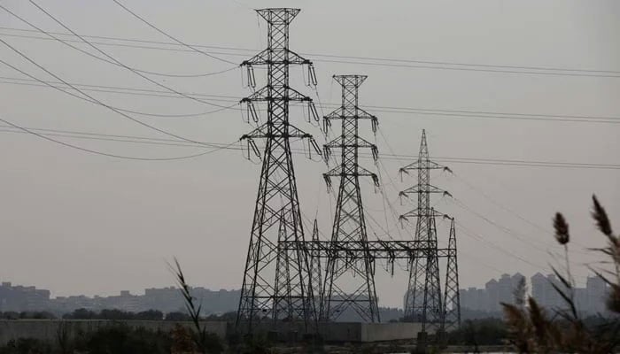 A energy transmission tower is seen one day after an energy breakdown throughout the country, in Karachi, Pakistan, January 24, 2023.-Reuters