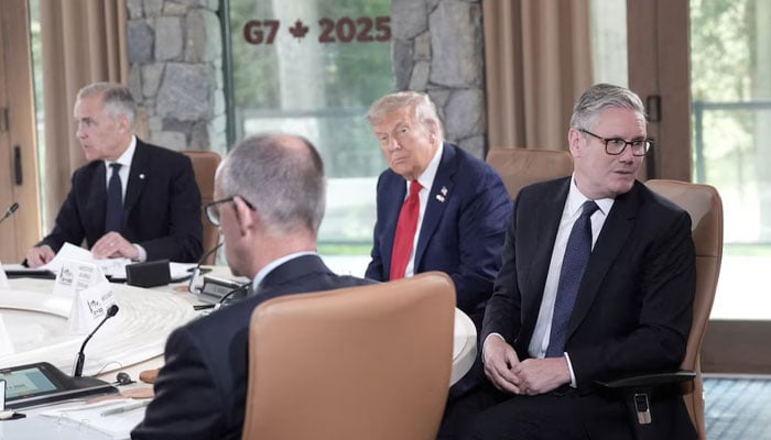 Prime Minister Keir Starmer and the president of the United States, Donald Trump, attend the first work session at the G7 Leaders Summit in Kananaskis, Alberta, Canada, June 16, 2025. - Reuters