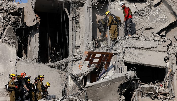 The emergency staff works in a residential site impacted, after an Iran missile attack in Israel, in the middle of the Israel-Iran conflict, in Beer Sheva, Israel on June 24, 2025.-Reuters