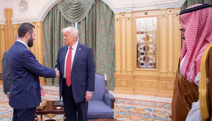 The president of the United States, Donald Trump, meets with Syrian President Ahmed al-Sharaa in Riad, Saudi Arabia, in this brochure published on May 14, 2025.-Reuters