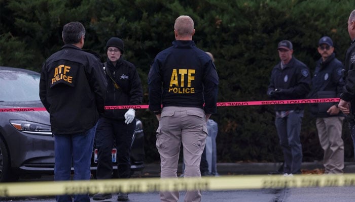 The law agents collect evidence near the scene of a shooting at the Boise Towne Square shopping center in Boise, Idaho, USA, October 25, 2021. - Reuters