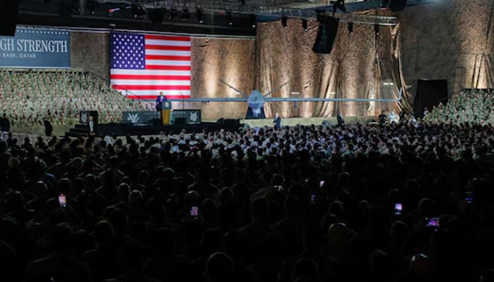 The president of the United States, Donald Trump, delivers comments to the US troops, together with a banner reading, peace through force, during a visit to the Air Base to the Udeid in Doha, Qatar, May 15, 2025. - Reuters