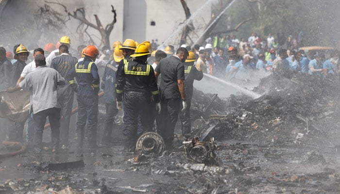 Firefighters work to publish burning remains on the site where an Air India Boeing 787 Dreamliner crashed crashed in Ahmedabad, India, June 12, 2025. - Reuters