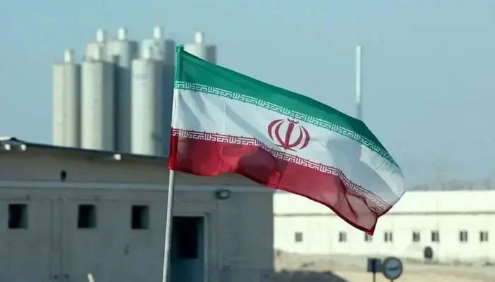 A photo taken on November 10, 2019 shows an Iranian flag at the Irans Bushehr nuclear energy plant. - AFP