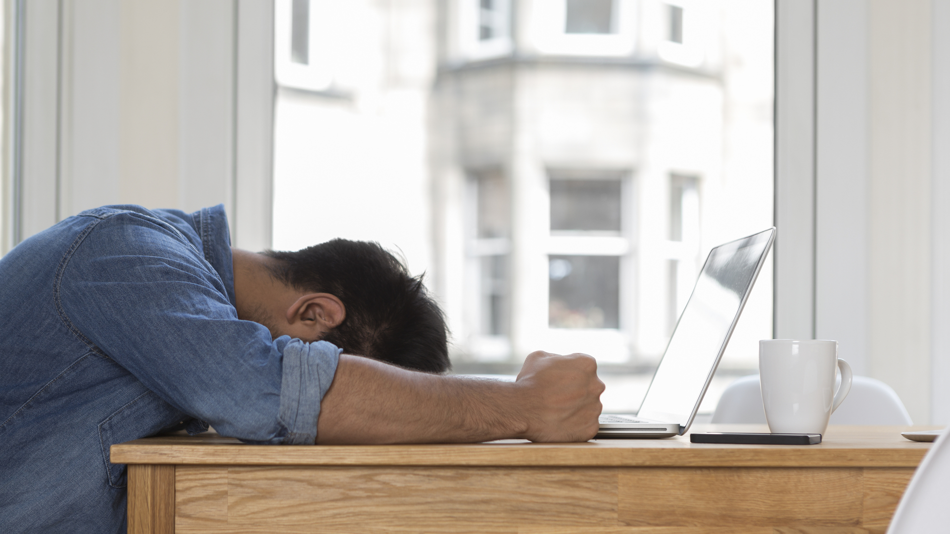 Annoying man using a laptop