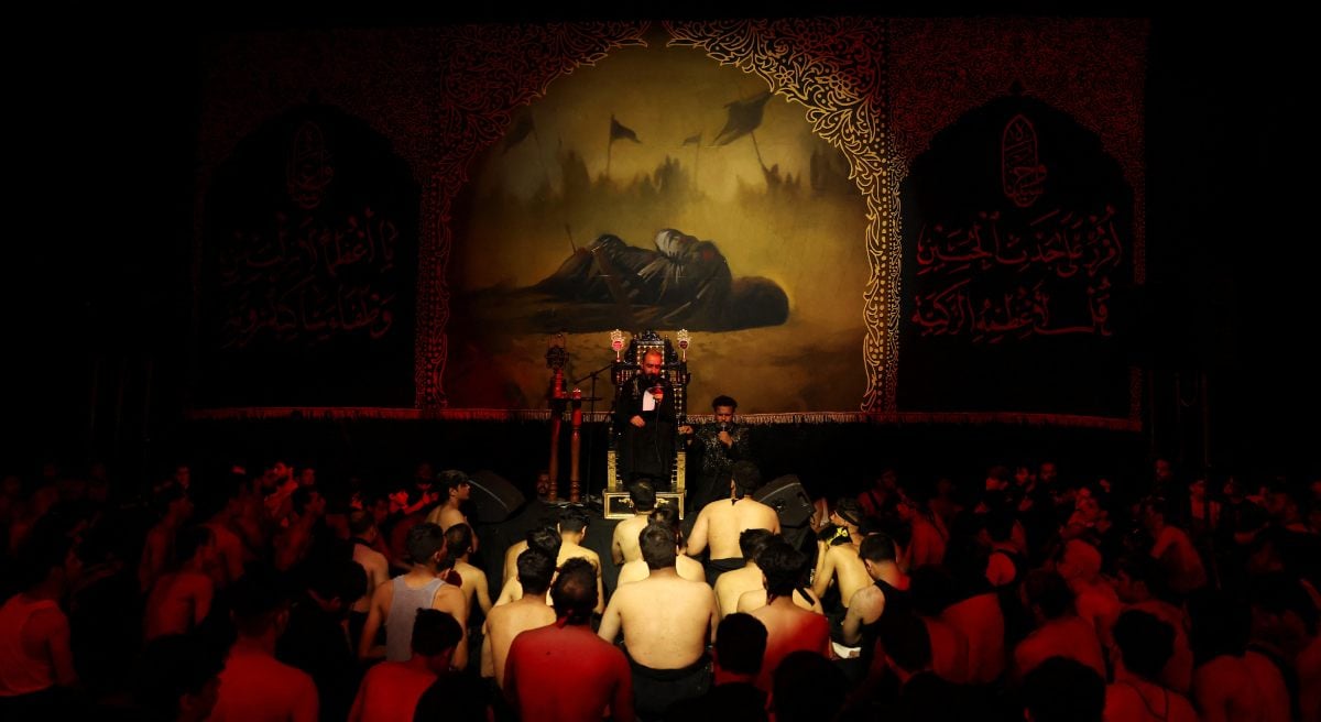 The mourners listen to a religious reciter during a grieving meeting that marks Ashura in Baghdad, Iraq, July 6, 2025. - Reuters
