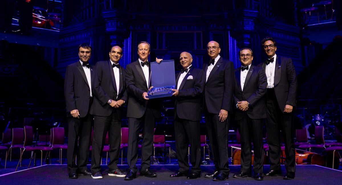 The former Prime Minister of the United Kingdom, Lord David Cameron (Central-left) awards an award to the founder of the Bestway group, Sir Anwar Pervez Obe (center-right), during the celebration of the 50th anniversary of Bestway Group at the Royal Albert Hall, London, Great Britain. - Reporter